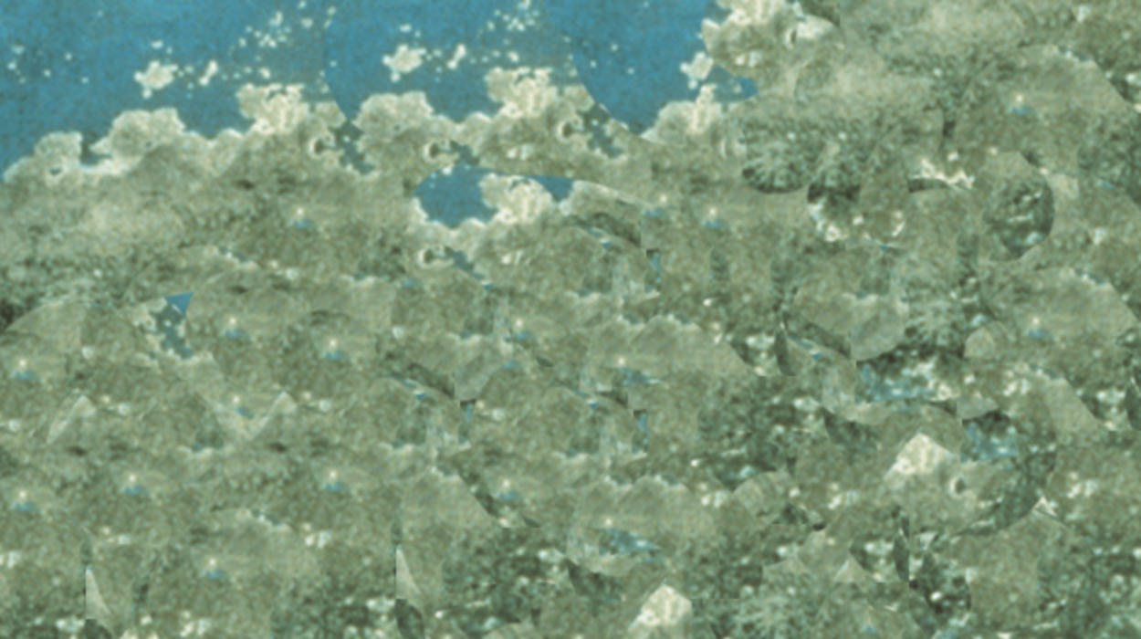 A wall painted blue long ago is showing signs of efflorescence.